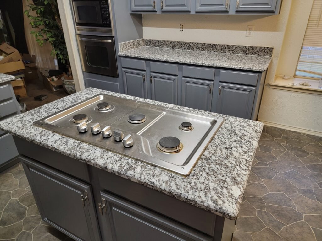 Granite kitchen stove top with white and black speckles